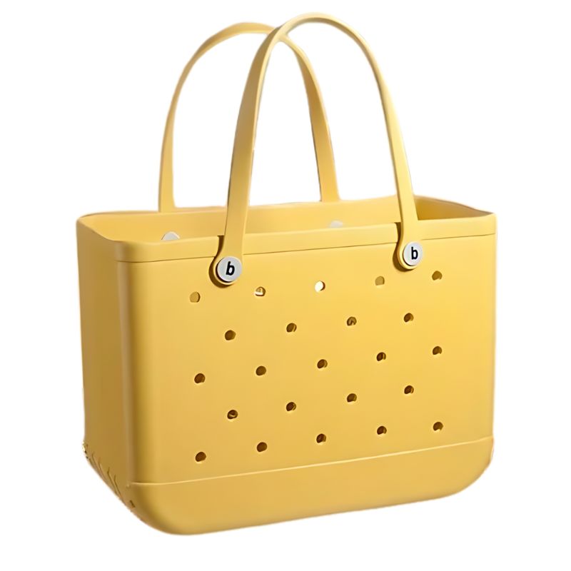 Photo d'un sac de plage, en caoutchouc, de couleur jaune. Il dispose de petits trous afin de permettre une aération des objets. Il a deux anses permettant de le porter à l'épaule.